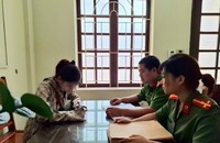 Chị N.T.A tại cơ quan công an. (Ảnh: CATH)