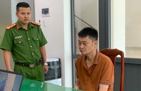Lê Phạm Bình, Giám đốc VPĐKĐĐ huyện Ea Súp tại cơ quan công an. Ảnh N.G
