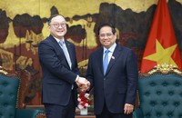 Thủ tướng Phạm Minh Chính tiếp ông Châu Gia Nghĩa, Chủ tịch châu Á - Thái Bình Dương của Tập đoàn Xây dựng Điện lực Trung Quốc. (Ảnh: VGP/Nhật Bắc).