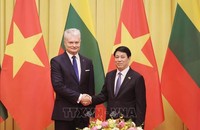 Chủ tịch nước Lương Cường với Tổng thống Litva Gitanas Nauseda. (Ảnh: TTXVN)