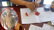 Đối tượng Đinh Minh Long và tang vật.