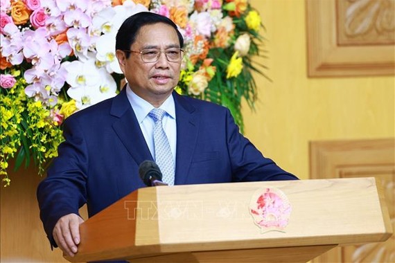 Thủ tướng Phạm Minh Chính tọa đàm với các doanh nghiệp Trung Quốc tiêu biểu trong lĩnh vực phát triển kinh tế xanh, kinh tế số. Ảnh: Dương Giang/TTXVN