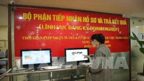 Đăng ký kinh doanh tại Sở Kế hoạch và Đầu tư Hà Nội. Ảnh: TTXVN.