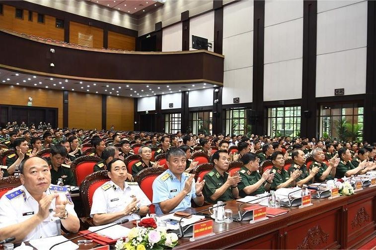 Các đại biểu tại điểm cầu trung tâm Bộ Quốc phòng. (Ảnh trong bài: Tuấn Huy)
